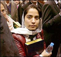 MP Malalai Joya clutches a copy of the Koran to her chest