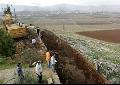 Army Forensics inspect grave site in Anjar.