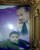 A detail of a photo of Dr. Ehab al-Shaer and his young son (Rami Almeghari)