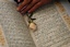  Quran -An Afghan woman uses a rose to help her read the Quran at a madrassa, or Islamic school, during the holy fasting month of Ramadan in Kabul, Afghanistan, Oct. 22, 2004. (AP Photo/Emilio Morenatti) hf1  