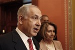 Israeli Prime Minister Benjamin Netanyahu, accompanied by House Speaker Nancy Pelosi of Calif., speaks on Capitol Hill in Washington, Tuesday, May 19, 2009.