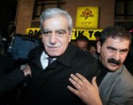 Ahmet Turk, Chairman of the pro-Kurdish Democratic Society Party, speaks to the media outside his party headquarters in Ankara, Turkey, late Friday, Dec. 11, 2009, hours after Turkey's highest court closed the pro-Kurdish party for having links to Kurdish rebel group of the Kurdistan Workers' Party, or the PKK.