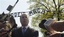 Israel's Deputy Prime Minister Silvan Shalom talks to journalists in front of the main entrance to the former Nazi Death Camp Auschwitz, in Oswiecim, southern Poland, Tuesday, April 21, 2009.