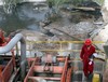 An oil worker walks on a new well Tuesday, May 6, 2008, which is being drilled in the Sakhir, Bahrain, oil fields in the Persian Gulf. Oil futures blasted to a new record over $122 a barrel Tuesday, gaining momentum as investors bought on a forecast of much higher prices and on any news hinting at supply shortages. A new Goldman Sachs prediction that oil prices could rise to $150 to $200 within two years seemed to motivate much of Tuesday's buying, although a falling dollar and increasing concerns about declining crude production in Mexico and Russia contributed, analysts say. (AP Photo / Hasan Jamali)hg3