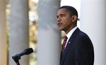 President Barack Obama speaks in the Rose Garden of the White House about health care reform and Iraq's new electoral law after returning from Camp David Sunday, Nov. 8, 2009, in Washington.