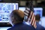 A specialist works on the floor of the New York Stock Exchange, Wednesday, Oct. 15, 2008. Investors agonizing over a faltering economy sent the stock market plunging all over again Wednesday after two disheartening reports convinced Wall Street that a recession, if not already here, is inevitab