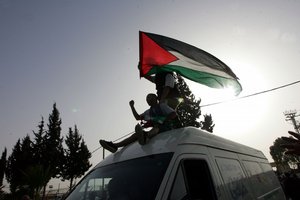 File - An aid convoy arrives in the Gaza Strip after crossing the border between Egypt and southern Gaza, on March 9, 2009 in the border town of Rafah.