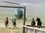 A KG Livestock helicopter pilot rounds up wild horses from the Fox & Lake Herd Management Area as part of the Bureau of Land Management Winnemucca Field Office's emergency operation to remove some 270 horses from the range on Sunday, July 13, 2008, in Washoe County, Nev., near the town on Empire, Nev. The horses are being removed because water is expected to become limited by mid-August due to drought conditions.