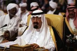 King Abdullah of Saudi Arabia attends the closing session of the Arab Summit in Doha, Qatar, Monday, March 30, 2009. Libyan leader Moammar Gadhafi stormed out of an Arab summit on Monday after denouncing the Saudi king and declaring himself "the dean of Arab rulers." Gadhafi disrupted the opening Arab League summit in Qatar by taking a microphone and criticizing Saudi's King Abdullah, calling him a "British product and American a