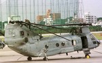 U.S. Marines maintain a helicopter on the airstrip of the Futenma Marine Corps Air Station on the Japanese island of Okinawa Thursday, December 2, 1999.