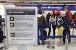 Passengers wait to check in for flights at Detroit Metropolitan Airport in Romulus, Mich., Tuesday, Dec. 29, 2009.