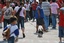 MARCH 21 , 2009 , MANILA CITY , PHILIPPINES - FILIPINA GIRL WALKING WITH HER TSI TZU DOG ALONG THE PARK