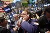 Traders work on the floor of the New York Stock Exchange Tuesday