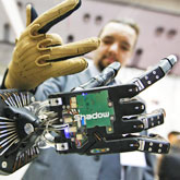 An employee of UK robot maker Shadow Robot Company wearing a data glove called CyberGlove, developed by CyberGlove