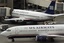 US Airways planes keep their hub at Sky Harbor Airport busy on Wednesday, July 25, 2007 in Phoenix. U.S. airline stocks dropped Thursday as carriers continued to struggle with high fuel prices and maintenance, and quarterly earnings for US Airways dropped to $263 million, or $2.77 per share, from $305 million, or $3.25 per share, in the prior-year period.