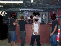 A group in a clubhouse draped with Nazi flags