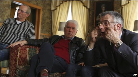 From left: Gianni Bisoli, 60, Dario Laiti, 59, and Alessandro Vantini, 60, are interviewed in a Roman hotel room, 26 March 