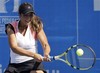 Aravane Rezai from France returns a ball to Ukraine's Viktoriya Kutuzova during their first round match at Istanbul Cup tennis tournament in Istanbul, Turkey, Monday, July 27, 2009.(