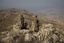 Pakistani soldiers secure an area on top of Kund mountain near Kotkai village in South Waziristan Pakistan on Thursday Oct. 29, 2009.