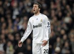 Real Madrid's Gonzalo Higuain from Argentina reacts during the second leg of the first knockout round Champions League soccer match against Lyon at the Santiago Bernabeu stadium in Madrid, Wednesday March 10, 2010