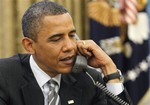 President Barack Obama calls British Prime Minister David Cameron from the Oval Office at the White House in Washington, Tuesday, May 11, 2010.