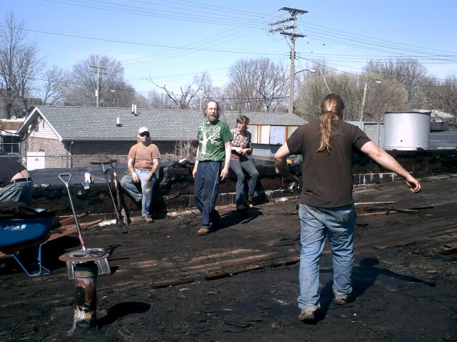 March 2010 Roof Renovation 02: Here are some of our stalwart volunteers engaging in a mix of well-earned break time and rooftop dancing.