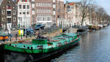 Houseboats line Amsterdam's Prinzengracht canal.