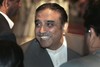 In this March 9, 2008 file photo, Asif Ali Zardari, widower of slain opposition leader Benazir Bhutto and co-chairman of Pakistan People's Party shares a light moment with journalists prior to a press conference in Bhurban, Pakistan. Zardari has agreed to run for Pakistani presidency, a party official said on Saturday, Aug