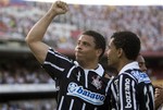 Corinthians' Ronaldo, left, celebrates with teammate Dentinho after scoring against Sao Paulo FC at a Brazilian league soccer match in Sao Paulo, Sunday, Sept. 27, 2009