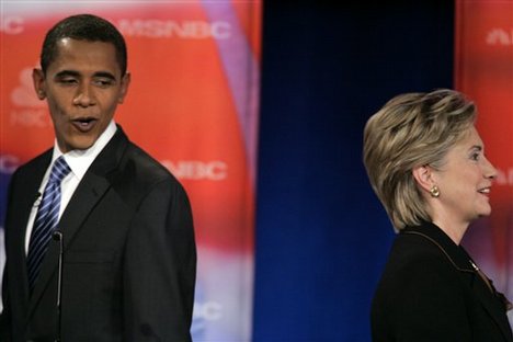 Democratic presidential hopefusl Sen. Hillary Rodham Clinton, D-N.Y., and Sen. Barack Obama, D-Ill., pass each other during a break at a debate at Drexel University in Philadelphia, Tuesday, Oct. 30, 2007