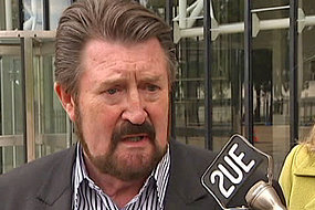 TV Still of Derryn Hinch outside High Court