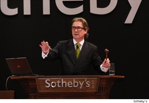 Jamie Ritchie, auctioneer, presiding over a Sotheby's wine auction.