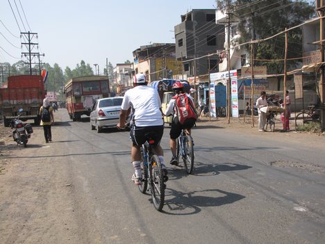 a man cycling on a road