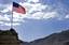 The American flag sways in the wind at Forward Operating base Baylough in the Zabul province of Afghanistan June 6, 2010.