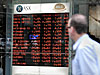 Shares defy US lead to close lower