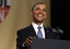 President Barack Obama reacts after the presidential seal fell off of the podium as he was speaking at Fortune's Most Powerful Women Summit in Washington, Tuesday, Oct. 5, 2010.