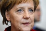 German Chancellor Angela Merkel arrives at a faction meeting of the German Christian Union Party's in Berlin, Tuesday, May 18, 2010.