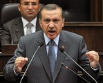 Turkish Prime Minister Recep Tayyip Erdogan addresses the lawmakers of his Justice and Development Party at the parliament in Ankara, Turkey, Tuesday, Aug. 11, 2009.