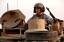 MISSION IN MOSUL - A U.S. soldier with the 3rd Armored Cavalry Regiment stands in the turret of his M1-A1 Abrams tanks before a mission in Mosul, Iraq, Feb. 14, 2008.