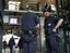 Police patrol the Gare du Nord train station in Paris where security was reinforced Thursday, July 7, 2005, following a series of deadly bombings in London. The French government, which strongly condemned the attacks, raised its terror alert level to the second-highest ranking.