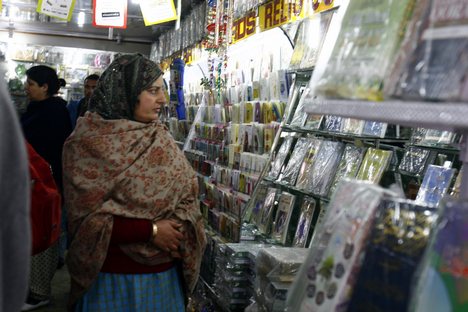 Kashmiri Muslim purchase eid cards ahead of the Eid al-Adha festival in Srinagar, the summer capital of Indian Kashmir, 08, December, 2008.