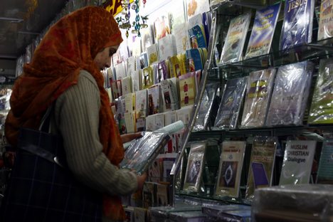 Kashmiri Muslim purchase eid cards ahead of the Eid al-Adha festival in Srinagar, the summer capital of Indian Kashmir, 08, December, 2008.