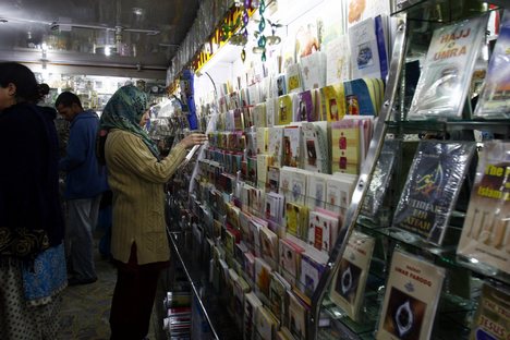 Kashmiri Muslim purchase eid cards ahead of the Eid al-Adha festival in Srinagar, the summer capital of Indian Kashmir, 08, December, 2008.