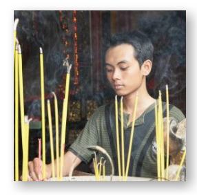 Vietnamese American young man at a traditional altar  Wilfried Krecichwost and Getty Images