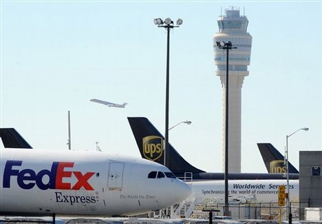 FedEx and UPS cargo planes sit on the tarmac of the north cargo terminal area at Hartsfield-Jackson Atlanta International Airport on Saturday, Oct. 30 2010 in Atlanta