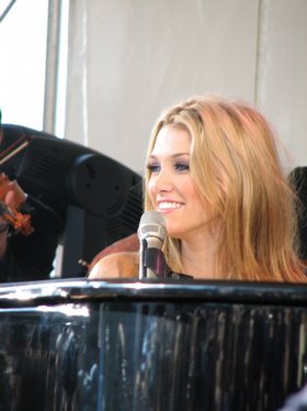 Goodrem performing during promotion in Australia