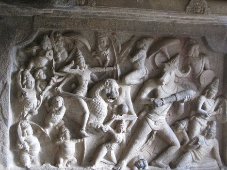 Durga Slays Mahisasura, Mahabalipuram sculpture. As a goddess, Durga's feminine power contains the energies of the gods. Each of her weapons was gifted to her by various gods: Rudra's trident, Vishnu's discus, Indra's thunderbolt, Brahma's kamandalu, Kuber's Ratnahar, etc.