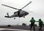 Sailors aboard George Washington (CVN 73) clear the area as an SH-60B Sea Hawk transports cargo netting from George Washington to USNS Henry J. Kaiser (T-AO 187) during a vertical replinishment.