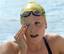 Australia's Marieke Guehrer rubs her eye during a practice session at the Olympic Aquatic Centre at the 2004 Olympic Games in Athens, Friday, Aug. 13, 2004.