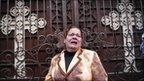 A woman grieves outside the al-Qiddissin Church in Alexandria (1 January 2010)